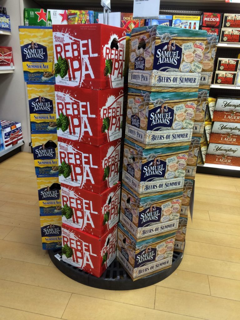 round plastic display holding cases of beer
