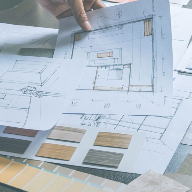 table with CAD drawings and sample fabric and color swatches
