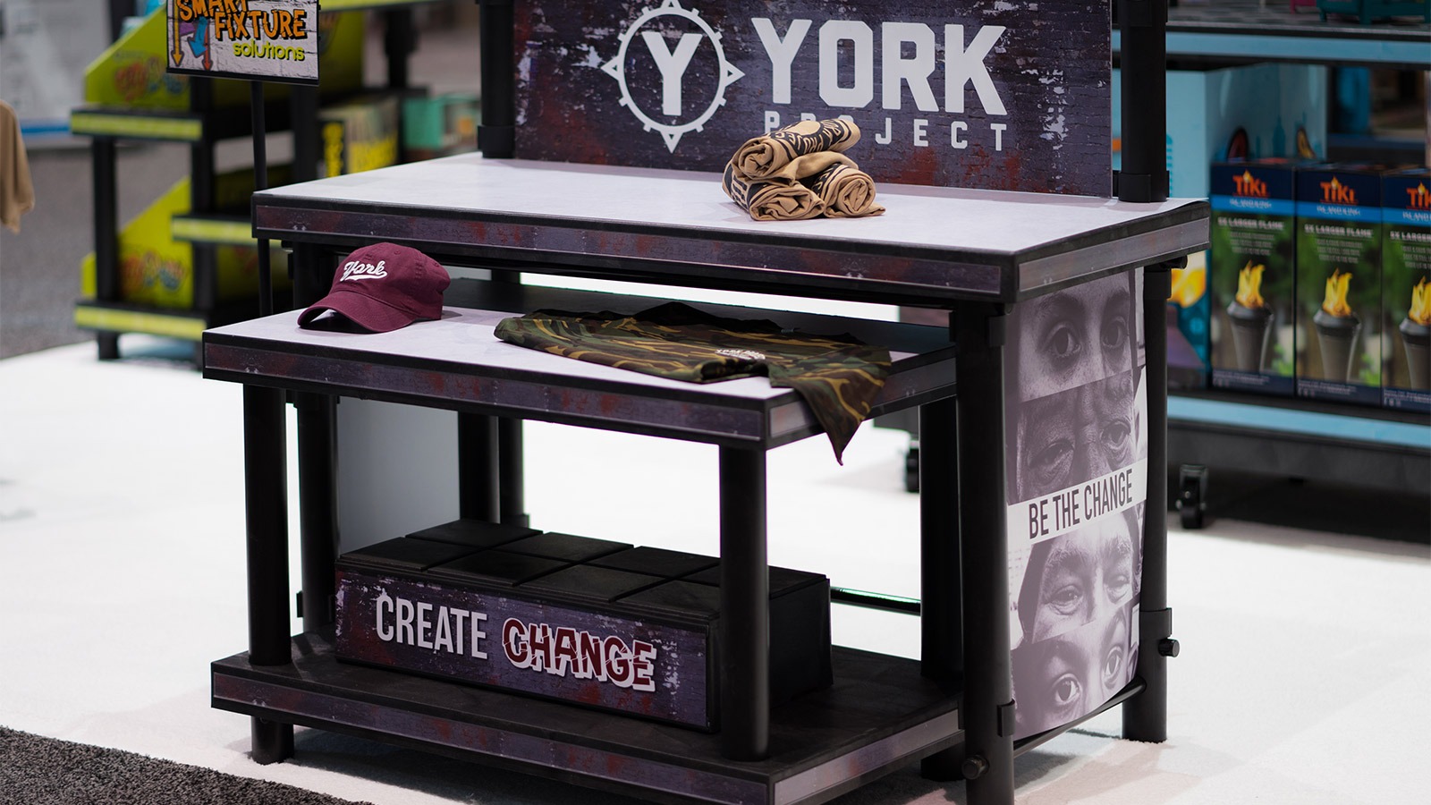Tiered table display with branded graphics.